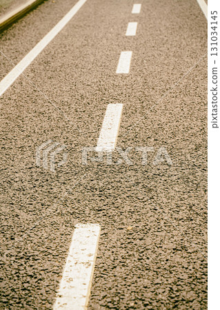 white stripes, road markings straight lines, cityscape close up 131034145