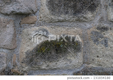 gray stone wall of the castle close-up, background of large cobblestones gray stone wall of the castle close-up, background of large cobblestones 131034180