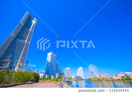 Yokohama cityscape in Japan, in front of Sakuragicho Station. View of Yokohama Landmark Tower reflecting sunlight. A ray of hope for tomorrow. 131034545