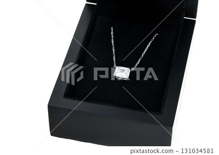A necklace is displayed in a black box 131034581
