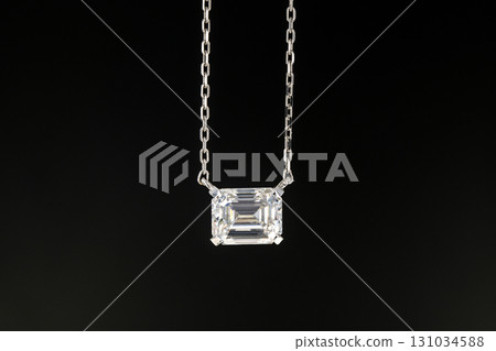 A necklace with a large diamond pendant 131034588