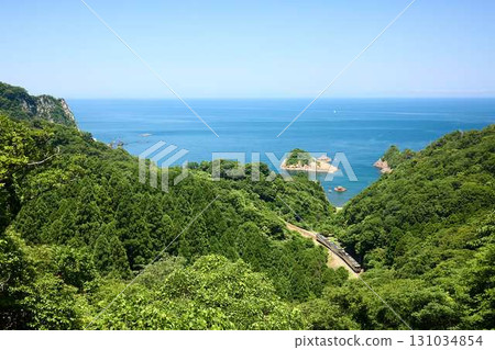 The Hamakaze express train runs along the Sea of Japan. The Hamakaze express train runs along the Sea of Japan. 131034854