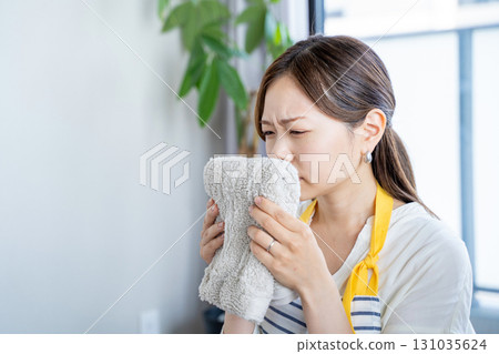 Housewives troubled by the smell of damp clothes dried indoors 131035624