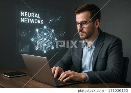 Tech savvy workspace featuring neural network analysis and professional male in modern office setting with laptop and graphs visible on screen 131036160