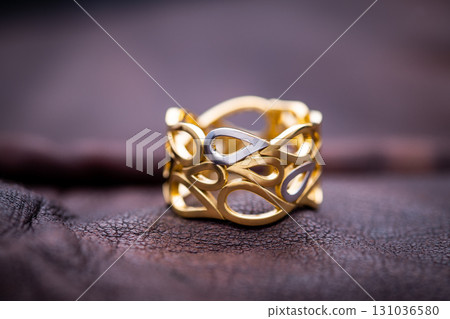 Luxury Yellow Gold Ring on Brown Leather Luxury Yellow Gold Ring on Brown Leather 131036580