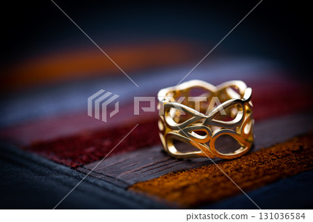 Luxury Yellow Gold Ring on Leather Background Luxury Yellow Gold Ring on Leather Background 131036584