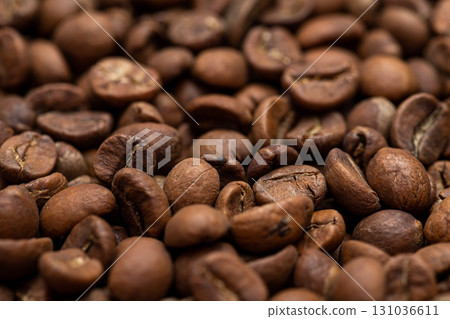 A close up of coffee beans with a grainy texture A close up of coffee beans with a grainy texture 131036611