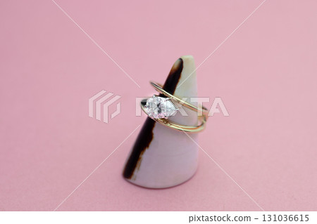 Gold Engagement Diamond Ring on Seashell Gold Engagement Diamond Ring on Seashell 131036615