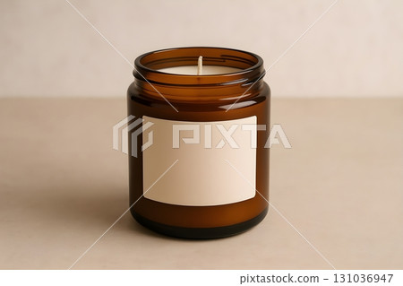 Amber glass jar candle with blank label on a neutral background, minimalist design for branding Amber glass jar candle with blank label on a neutral background, minimalist design for branding 131036947