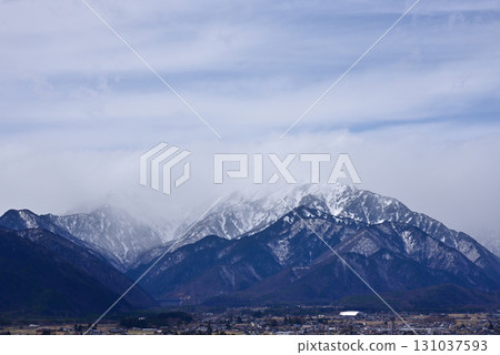 Shinshu scenery - Mount Renge in the Northern Alps shrouded in clouds 131037593