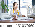 Housewife/housekeeper folding laundry 131037660