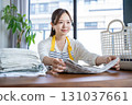 Housewife/housekeeper folding laundry 131037661