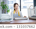 Housewife/housekeeper folding laundry 131037662