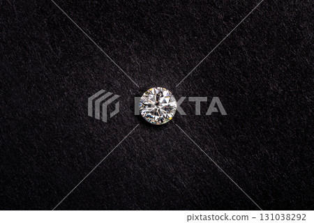 A diamond is on a black surface 131038292