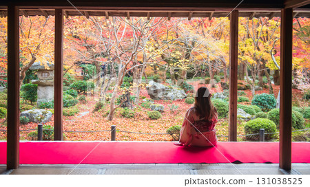 woman in Kimono at enkoji temple view fall leaf garden, Kyoto 131038525