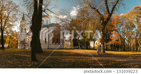 Historic Church Surrounded by Autumn Trees in City Park Historic Church Surrounded by Autumn Trees in City Park 131039223