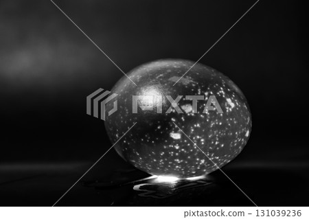 The photograph captures the essence of light and shadow as it plays across eggs 131039236