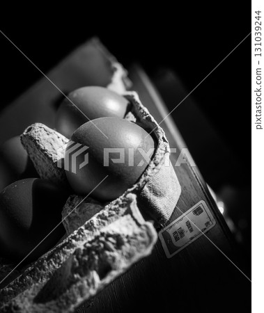 The photograph captures the essence of light and shadow as it plays across eggs 131039244