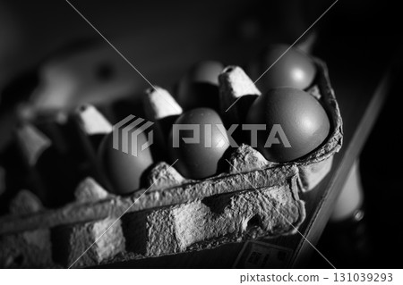 The photograph captures the essence of light and shadow as it plays across eggs 131039293