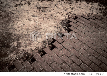 Where Nature Meets Structure Crumbling Brick Path and Dirt 131039335