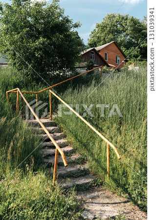 Old Concrete Stairs with Orange Handrails in Countryside Old Concrete Stairs with Orange Handrails in Countryside 131039341