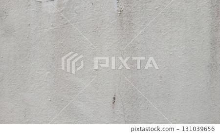 Textured grey concrete wall with weathered imperfections and subtle gradient background Textured grey concrete wall with weathered imperfections and subtle gradient background 131039656