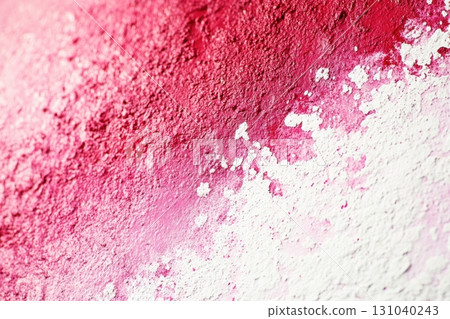 Vibrant textured wall with gradient of red and white hues in urban setting 131040243