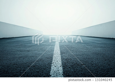 Wide road fading into foggy distance 131040245