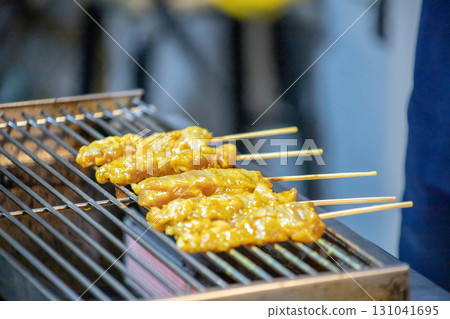 Skewer Raw Pork Satay on the grill grate 131041695