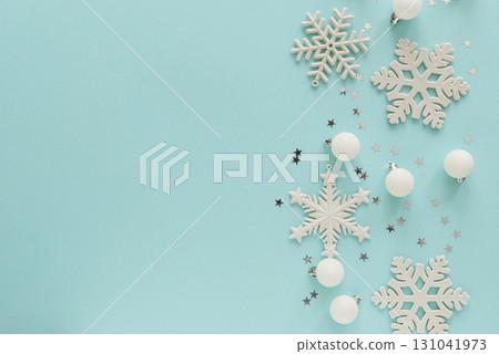 White Christmas Ornaments and Snowflakes on Light Blue Background White Christmas Ornaments and Snowflakes on Light Blue Background 131041973