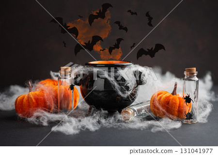 Halloween Cauldron with Pumpkins, Spiders and Cobwebs Halloween Cauldron with Pumpkins, Spiders and Cobwebs 131041977