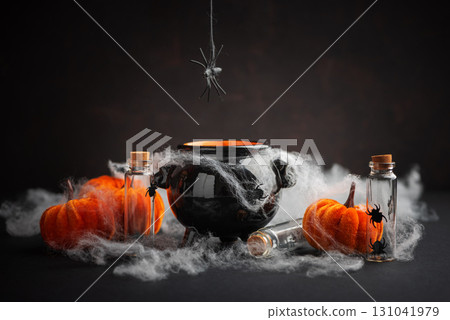 Halloween Cauldron with Pumpkins, Spiders and Cobwebs Halloween Cauldron with Pumpkins, Spiders and Cobwebs 131041979