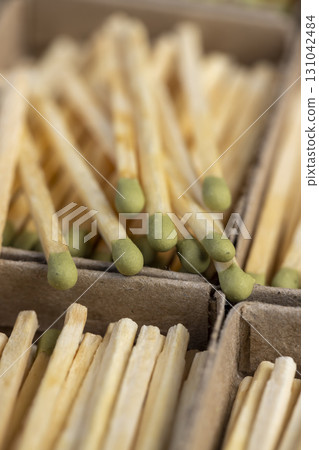 a lot of matchboxes with matches, matchboxes with matches made of wood, close up 131042484