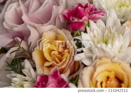arrangement of a large variety of flowers of different colors, a flower arrangement for giving from different colors and different types of flowers arrangement of a large variety of flowers of different colors, a flower arrangement for giving from different colors and different types of flowers 131042512