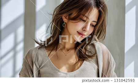 A beautiful woman looking down in a natural atmosphere 131042593