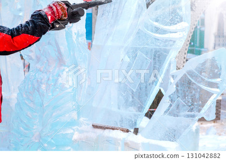 Ice sculpture creation on the city's central square 131042882