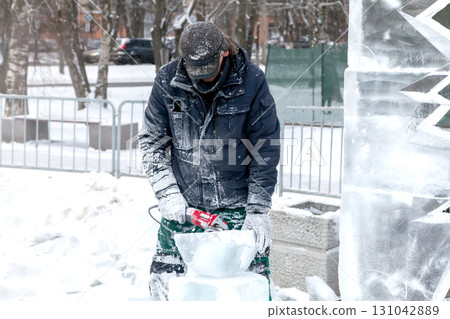 Ice sculpture creation on the city's central square 131042889