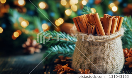 Rustic Bundle of Cinnamon Sticks With Holiday Decorations in Soft Focus Background 131043163