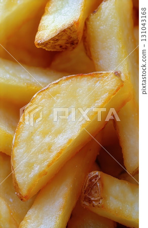 Crispy Golden French Fries Piled High, Perfect for Snacking or Sharing at Any Gathering or Meal. 131043168
