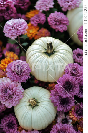 Colorful Autumn Display With White Pumpkins and Vibrant Flowers at a Seasonal Market. 131043235