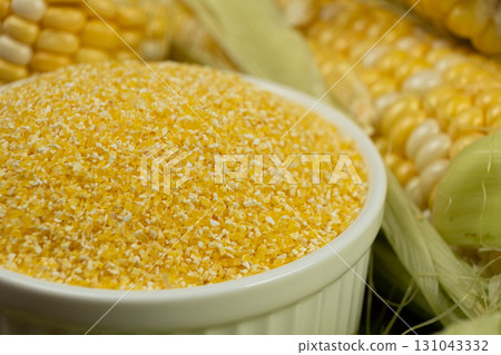 Close-up of raw uncooked gluten-free corn grits. 131043332