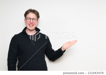 Portrait of happy Scandinavian mid adult man in black sweater smiling against white background Portrait of happy Scandinavian mid adult man in black sweater smiling against white background 131043479