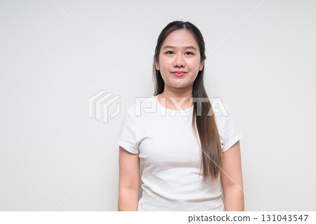 Portrait of young Asian woman against white background 131043547
