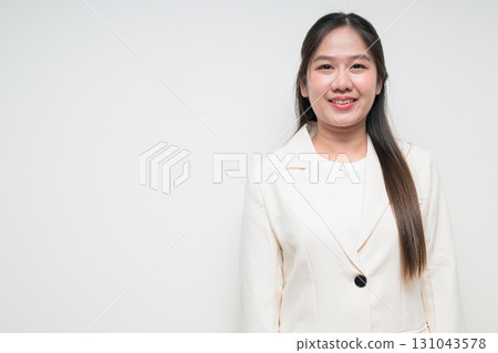 Portrait of young Asian woman wearing suit ready for business against white background Portrait of young Asian woman wearing suit ready for business against white background 131043578