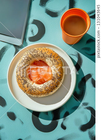 Fresh Bagel With Salmon on a Colorful Table and a Cup of Coffee in a Casual Setting 131043645