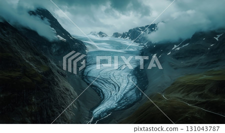 Majestic Glacier Flowing Between Rugged Mountains Under a Cloudy Sky 131043787