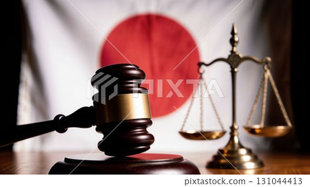 Justice gavel and scales with Japanese flag background 131044413