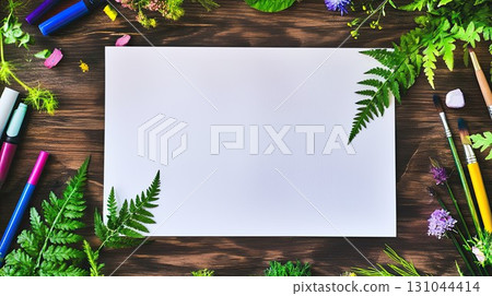 Blank paper sheet on wooden surrounded by natural elements including flowers and leaves, and grasses, offering a perfect eco mockup background for invitations, messages, or presentations 131044414