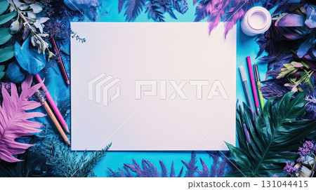 Blank sketch paper surrounded by markers and colored pencil sits atop vibrant pink and blue holographic colors and lush greenery, blending nature with creativity in a dreamy, colorful art workspace 131044415