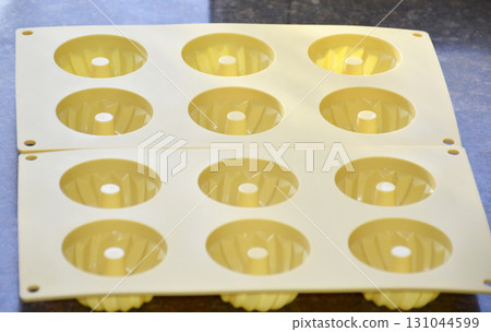 Silicone molds for baking cupcakes or puddings Silicone molds for baking cupcakes or puddings 131044599